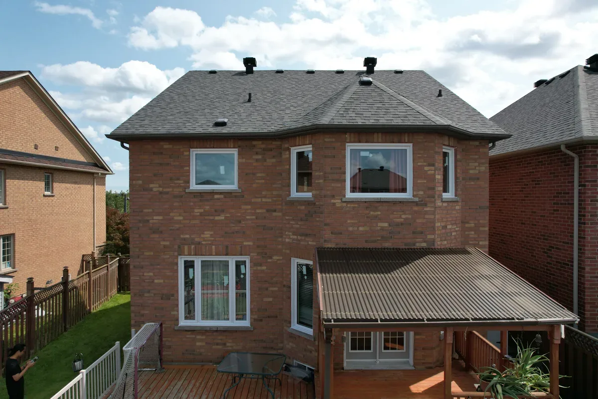 Aerial view of a GTA home in summer with new energy-efficient windows and a shaded backyard